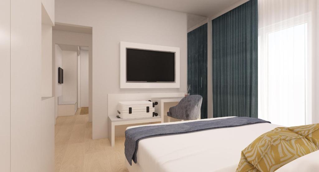 Postel nebo postele na pokoji v ubytování Astoria Suite Hotel