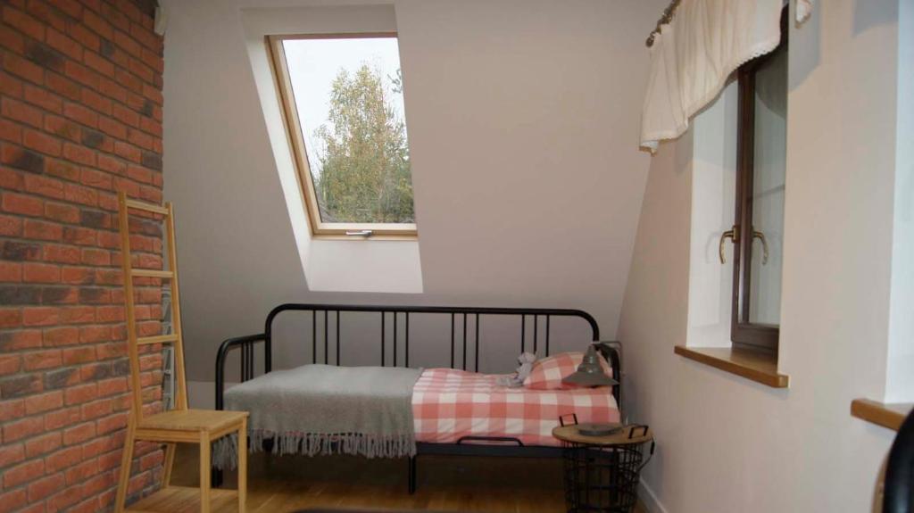 Postel nebo postele na pokoji v ubytování Lawendowe Siedlisko