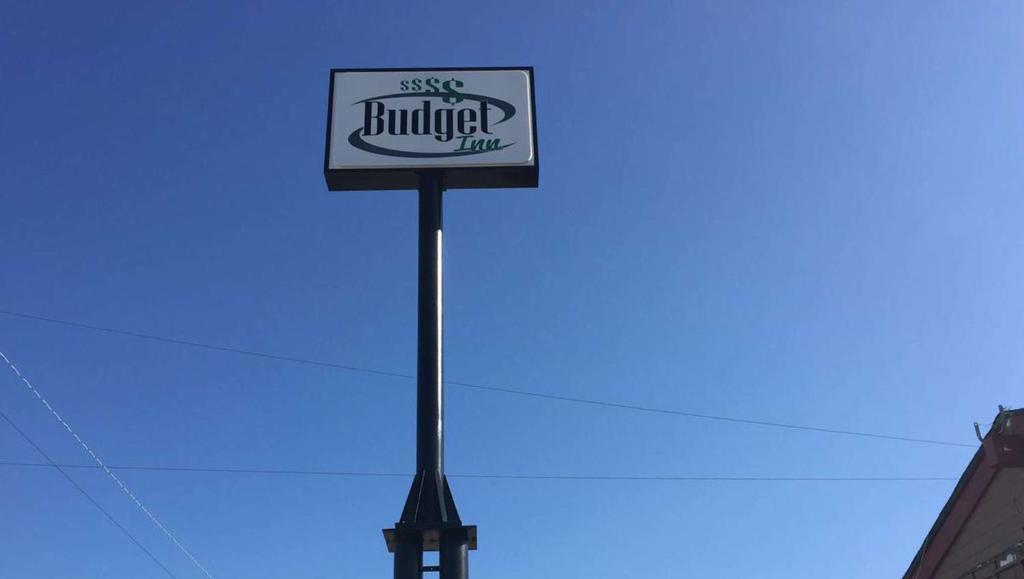 a sign for a burger king on a pole at Budget Inn Ardmore OK in Ardmore