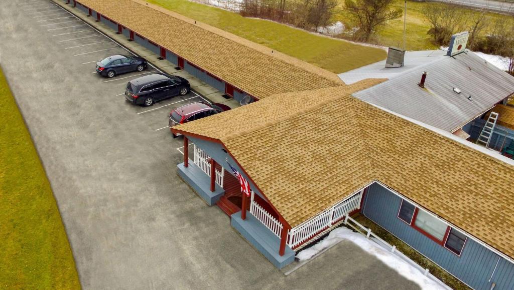 an overhead view of a building with cars parked in a parking lot at Pleasant Valley Motel West Stockbridge in West Stockbridge