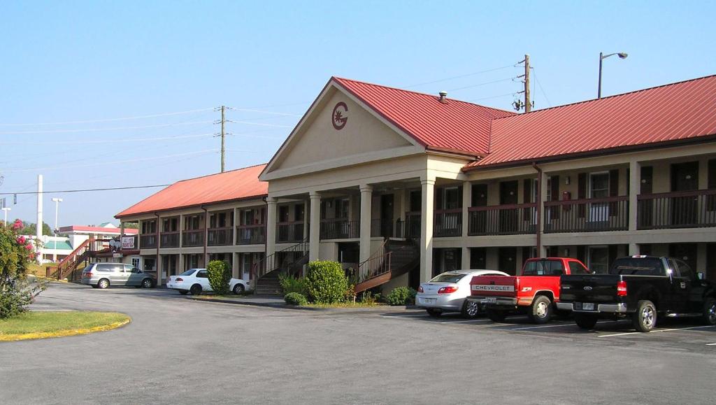 a large building with cars parked in front of it at M Star Hotel Cleveland in Cleveland