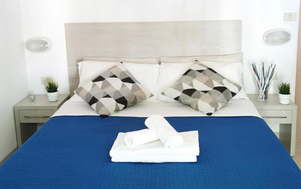 Łóżko lub łóżka w pokoju w obiekcie Hotel Bellini