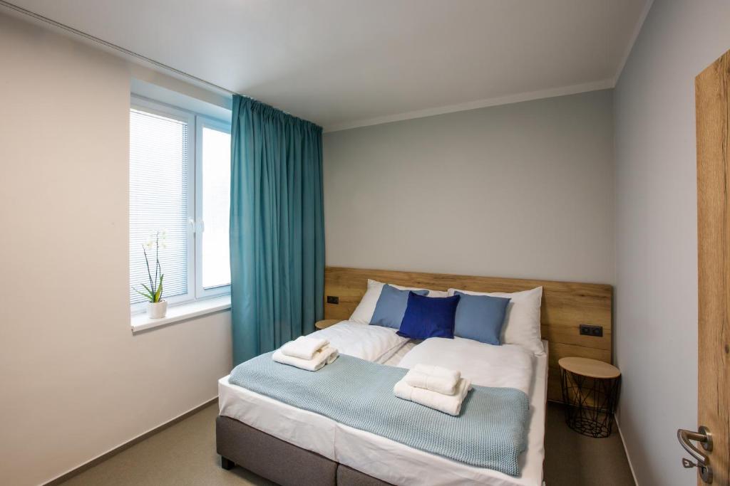 Postel nebo postele na pokoji v ubytování Penzion Start Ostrava