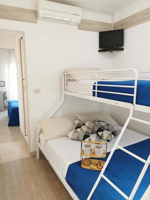 Łóżko lub łóżka w pokoju w obiekcie Hotel Bellini