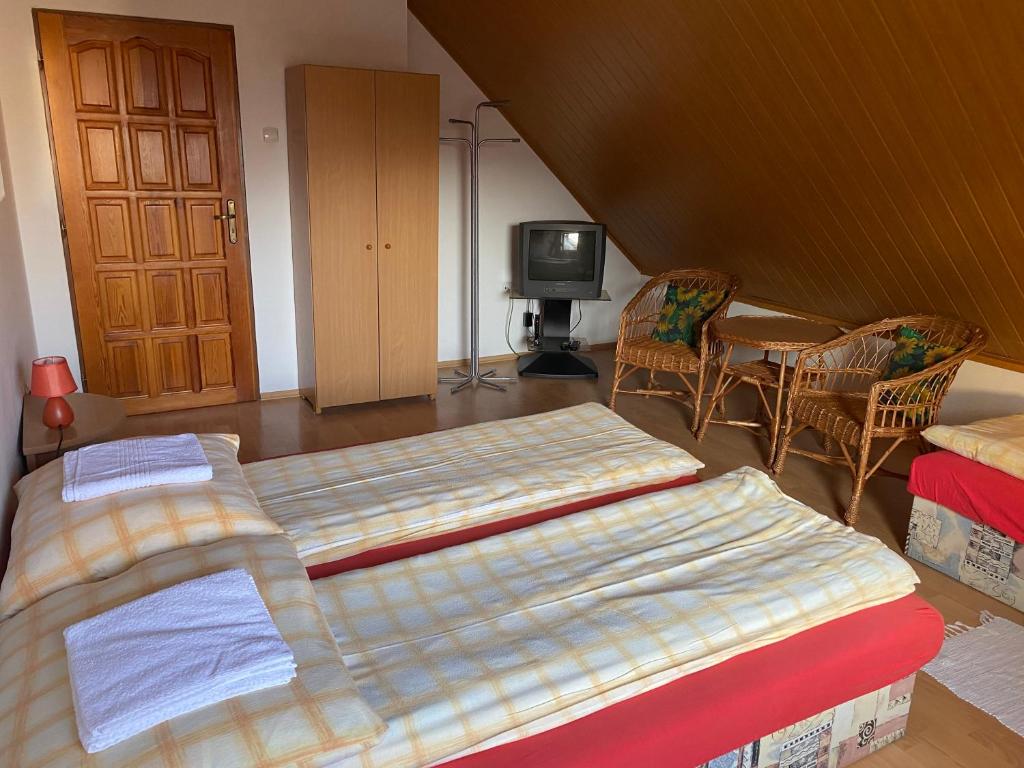 Posteľ alebo postele v izbe v ubytovaní Penzión Malý Rím