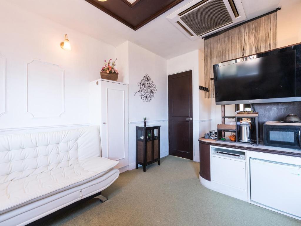 Kuchyň nebo kuchyňský kout v ubytování Tabist Hotel Nizi Fuefuki Misaka