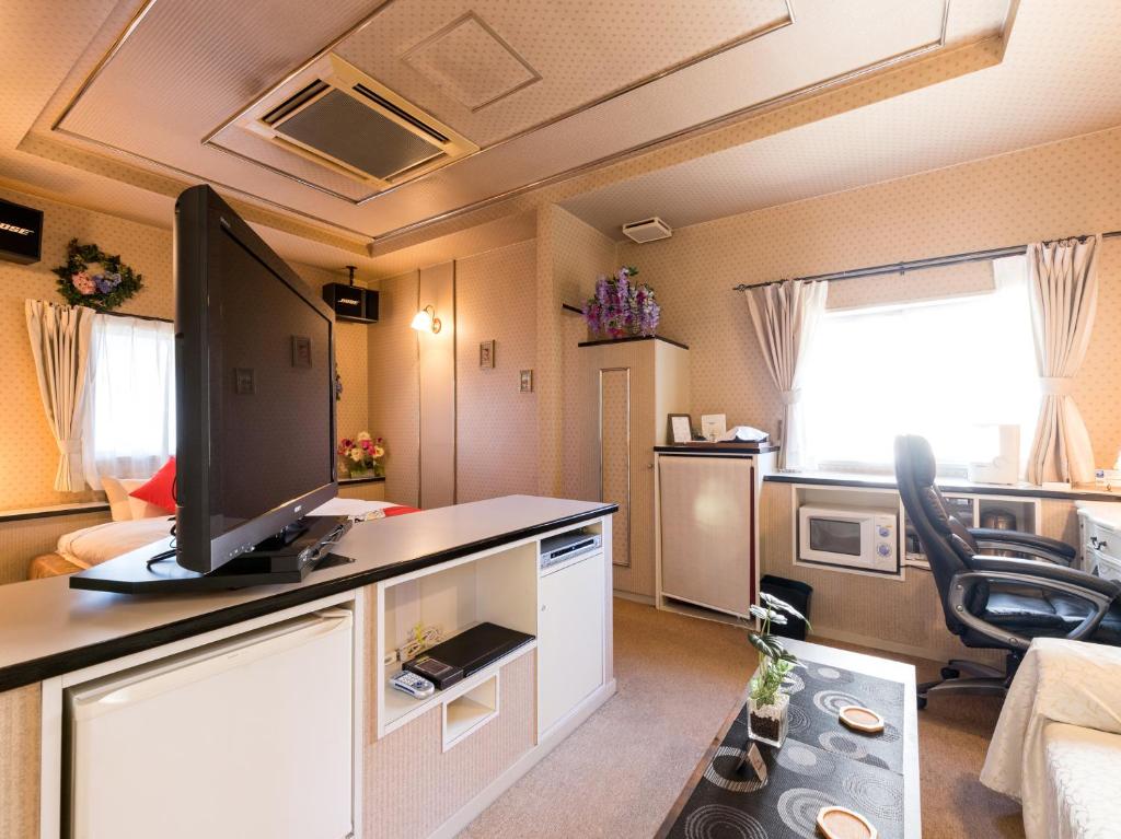 Kuchyň nebo kuchyňský kout v ubytování Tabist Hotel Nizi Fuefuki Misaka