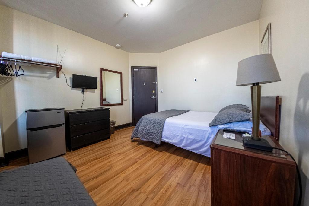 Postel nebo postele na pokoji v ubytování Shefah Hotel