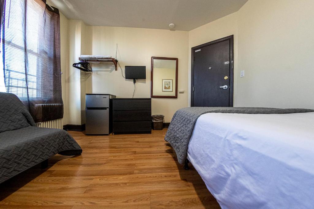 Postel nebo postele na pokoji v ubytování Shefah Hotel