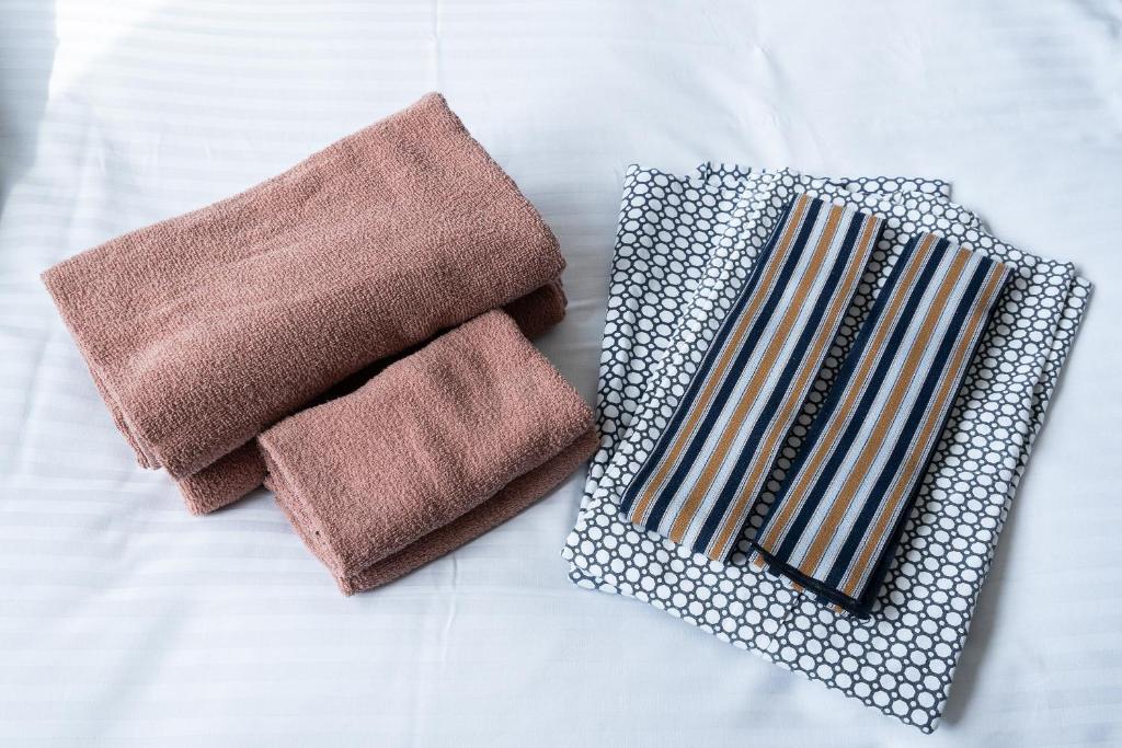 Postel nebo postele na pokoji v ubytování Tabist Hotel Ginga Kisarazu