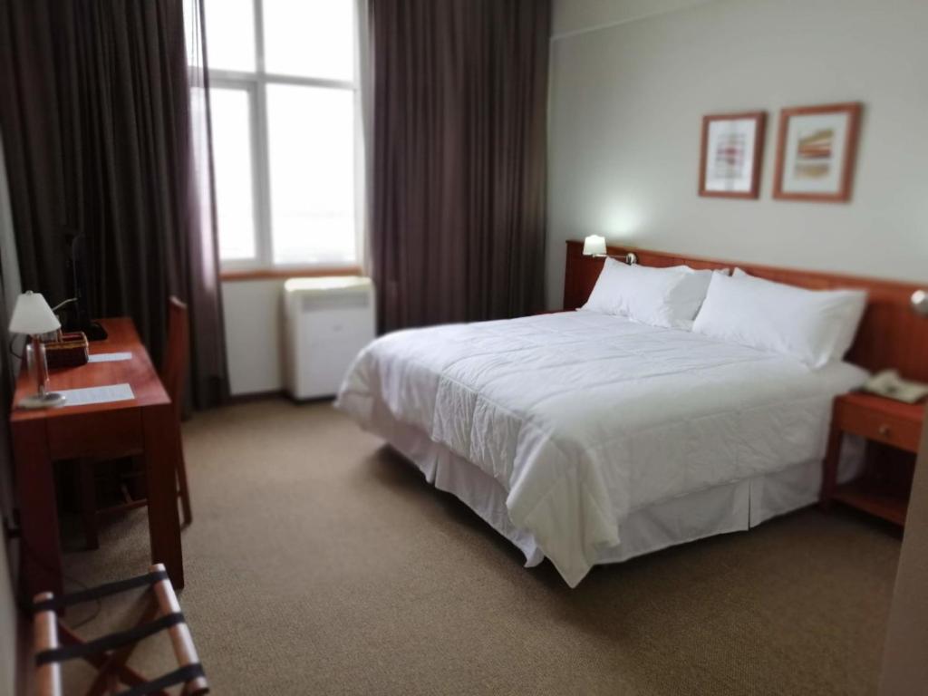Cama o camas de una habitación en Gran Hotel Isabel Riquelme
