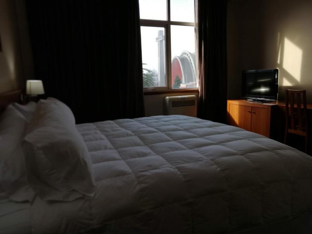 Cama o camas de una habitación en Gran Hotel Isabel Riquelme