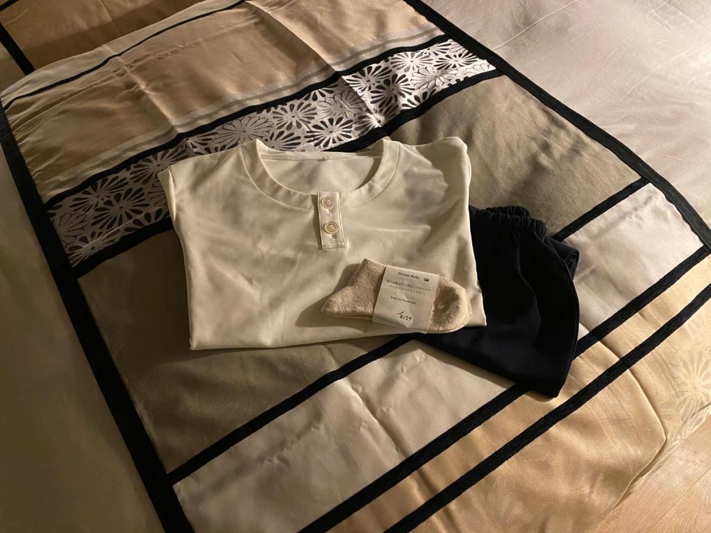 Letto o letti in una camera di 民家ホテル「金ノ三寸」(かねのさんずん）