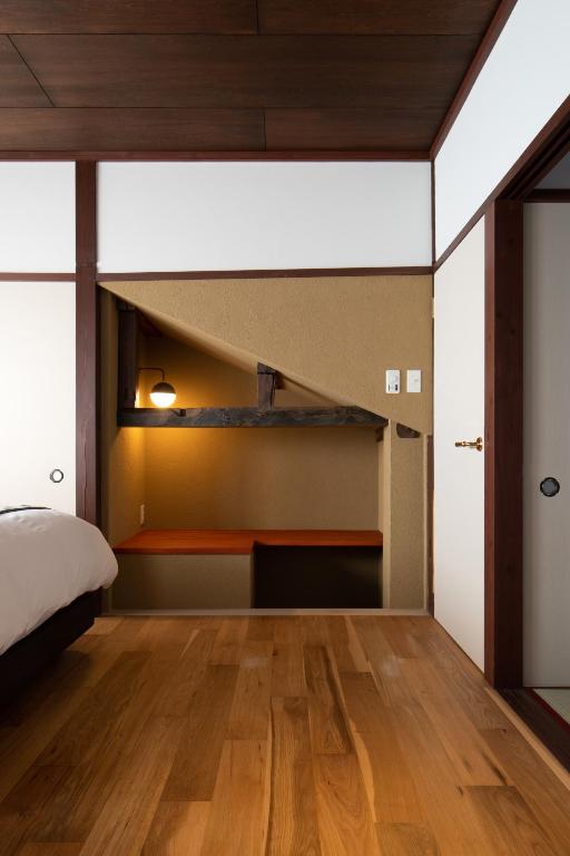 Letto o letti in una camera di 民家ホテル「金ノ三寸」(かねのさんずん）