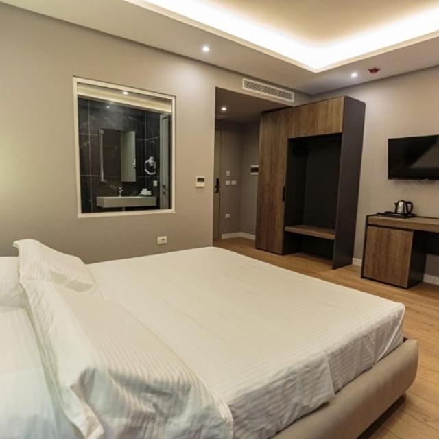 Postel nebo postele na pokoji v ubytování Real Hotel