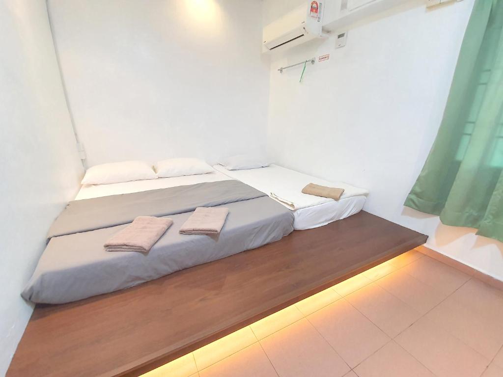 Postel nebo postele na pokoji v ubytování Grand Star Hotel