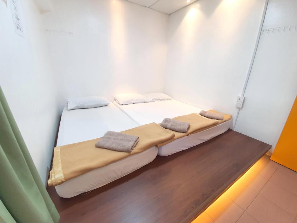 Postel nebo postele na pokoji v ubytování Grand Star Hotel