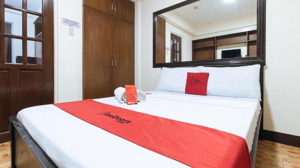 Postel nebo postele na pokoji v ubytování L Mansion 2 Palanan Makati City