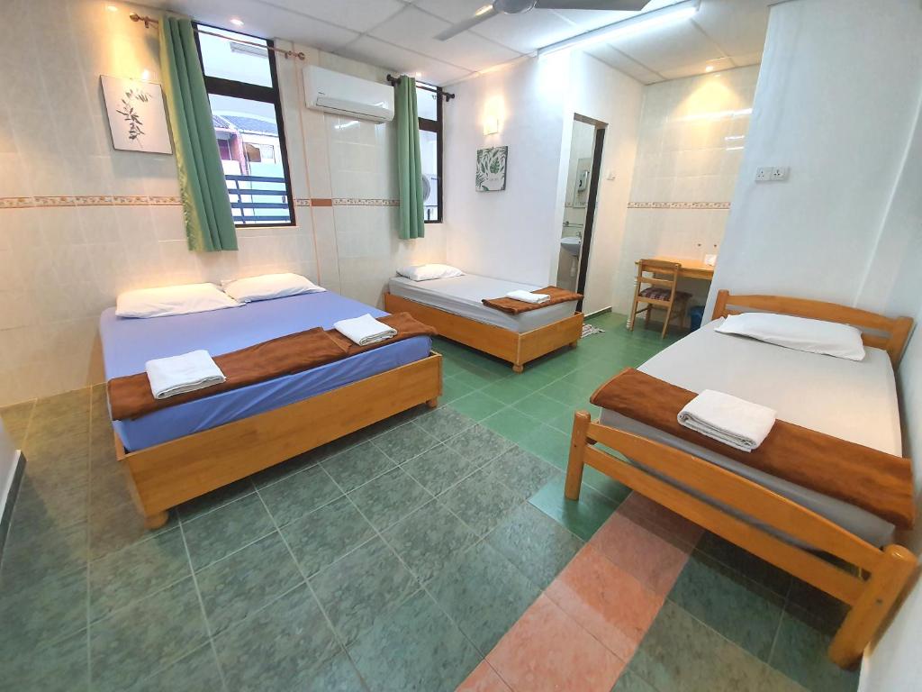 Postel nebo postele na pokoji v ubytování Grand Star Hotel