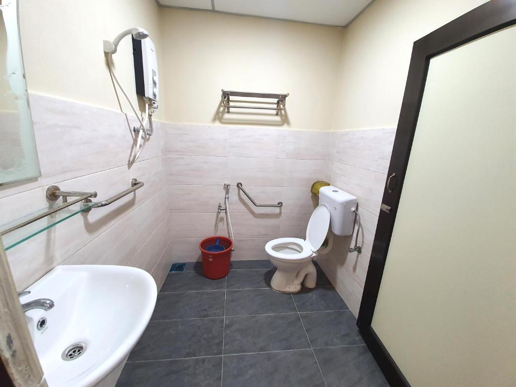 Koupelna v ubytování Grand Star Hotel