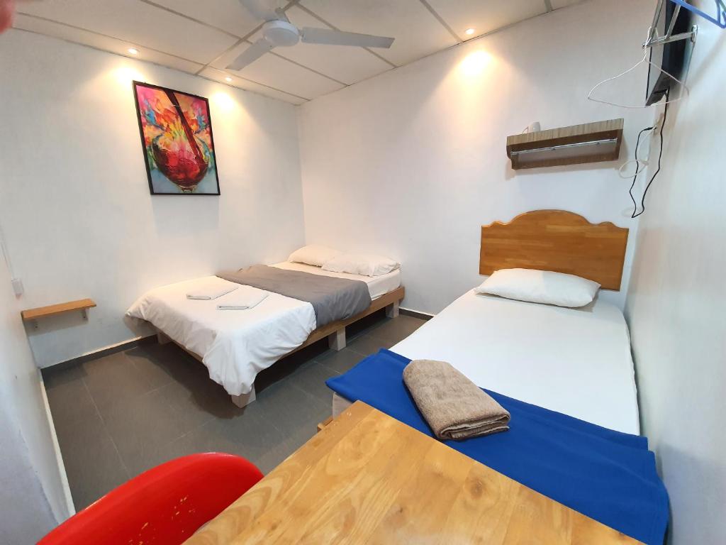 Postel nebo postele na pokoji v ubytování Grand Star Hotel