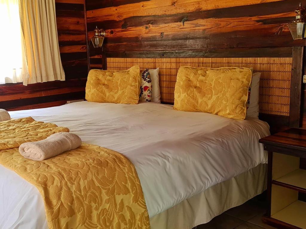 Postel nebo postele na pokoji v ubytování Kwalata Game Lodge
