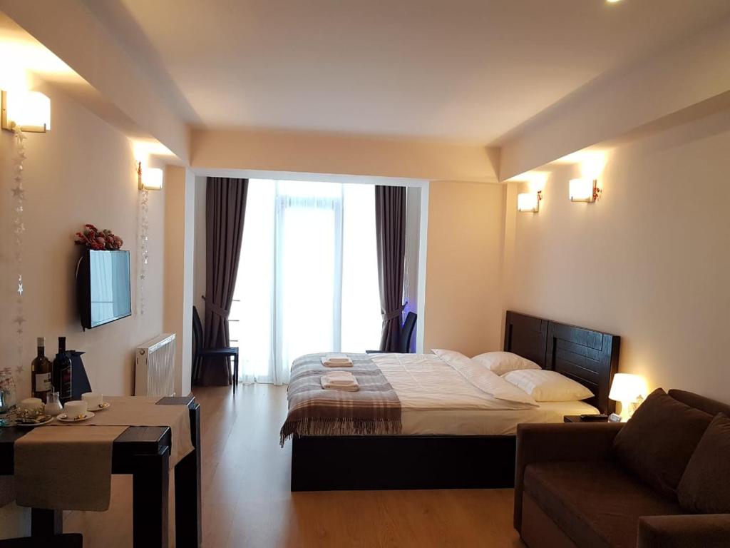 Postel nebo postele na pokoji v ubytování Happy Holidays Apartments in New Gudauri