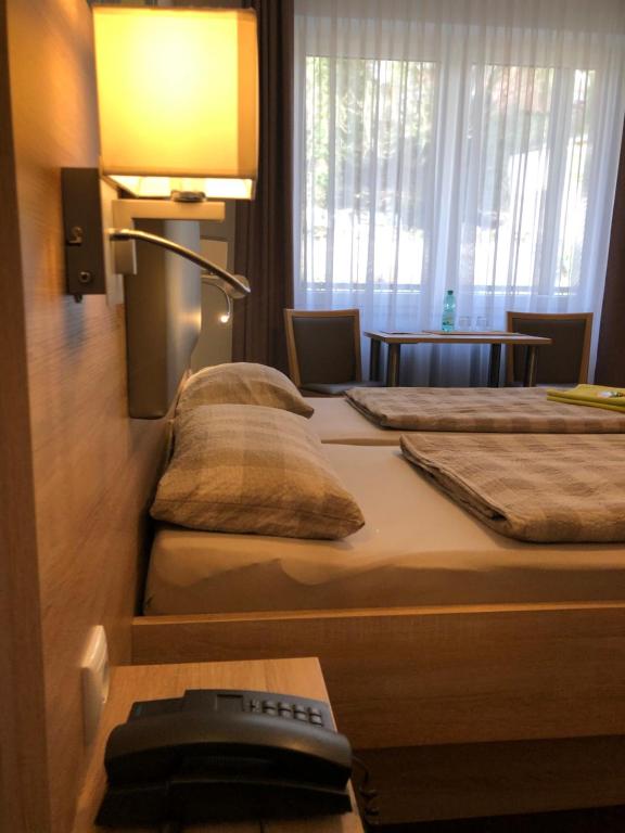 Postel nebo postele na pokoji v ubytování Hotel Baccara