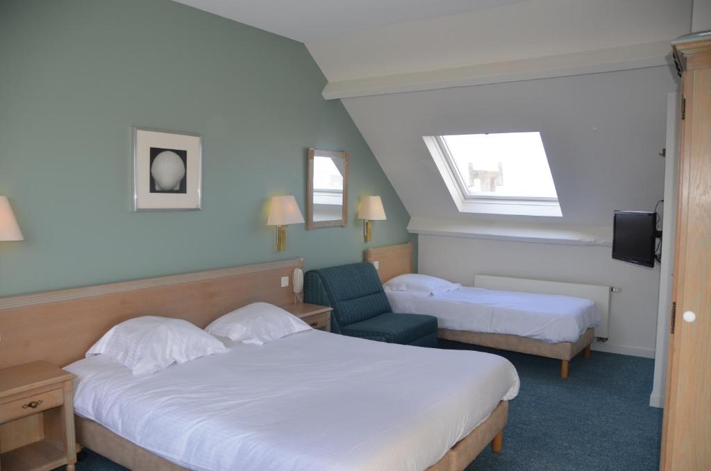 Postel nebo postele na pokoji v ubytování Hotel Sabot D'Or