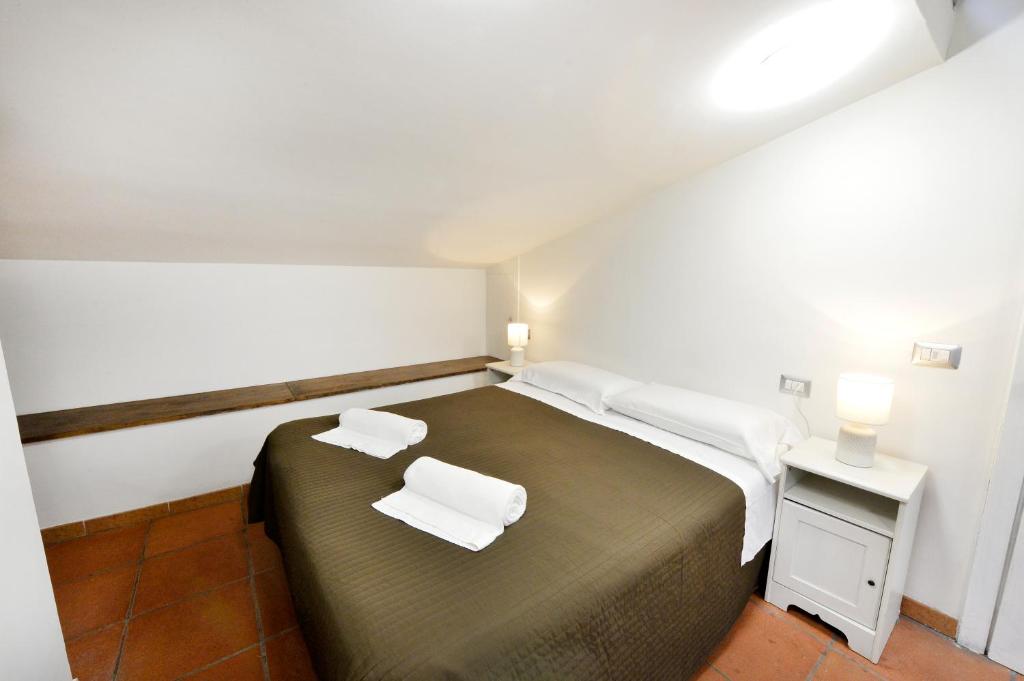 Łóżko lub łóżka w pokoju w obiekcie Perugia Apartments