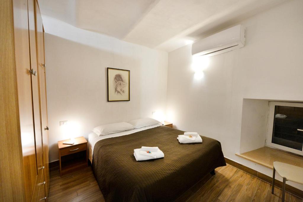 Łóżko lub łóżka w pokoju w obiekcie Perugia Apartments