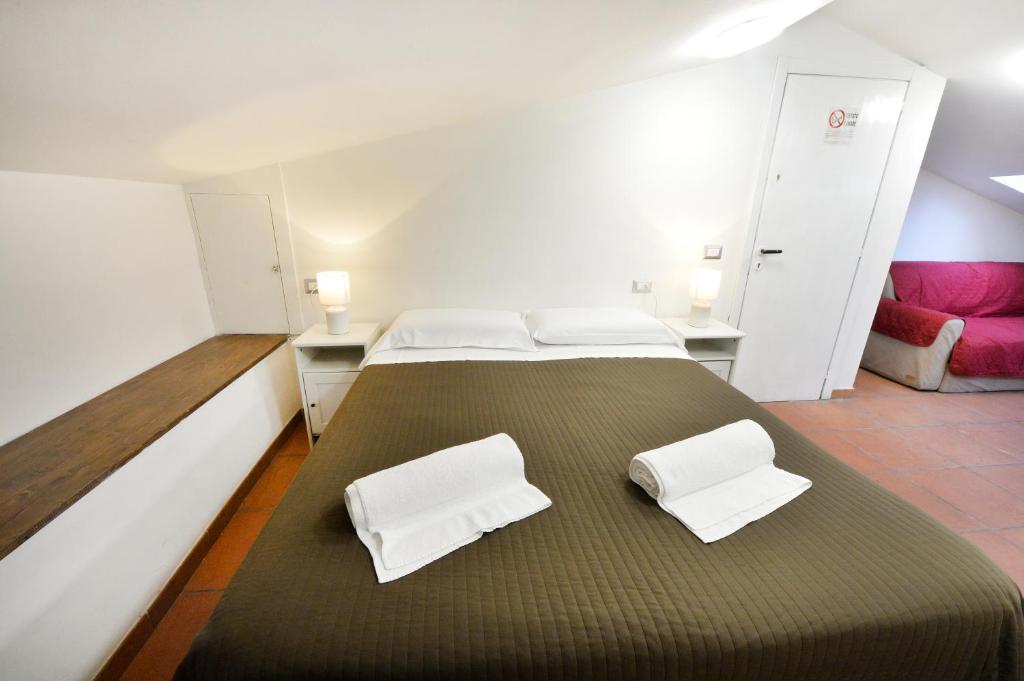 Łóżko lub łóżka w pokoju w obiekcie Perugia Apartments