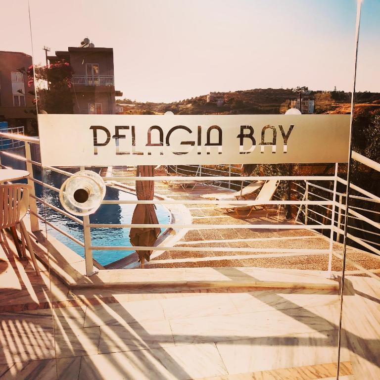 a sign on a boat that reads dragon bay at Pelagia Bay Hotel in Agia Pelagia
