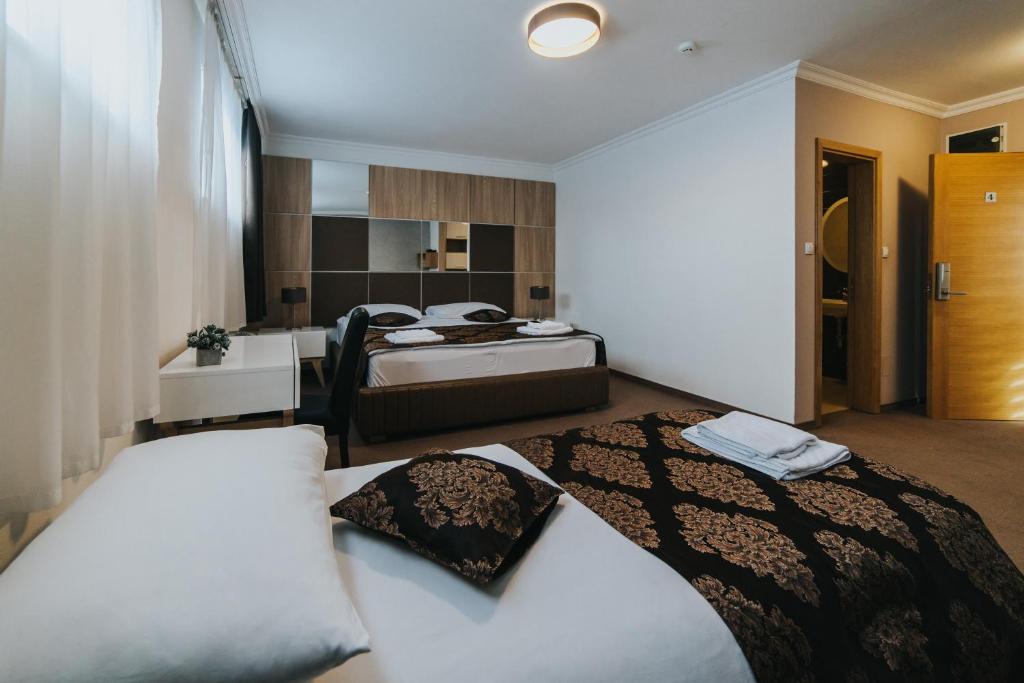 Postel nebo postele na pokoji v ubytování Hotel Brcko Gas Doboj