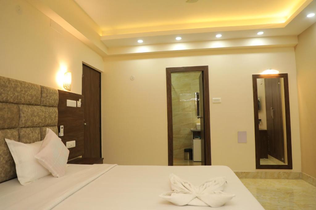 Postel nebo postele na pokoji v ubytování Hotel Bandhan Residency
