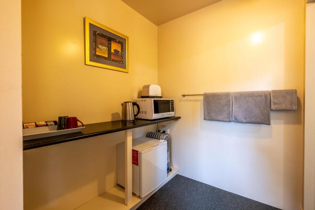 Kuchyň nebo kuchyňský kout v ubytování Kakapo Lodge