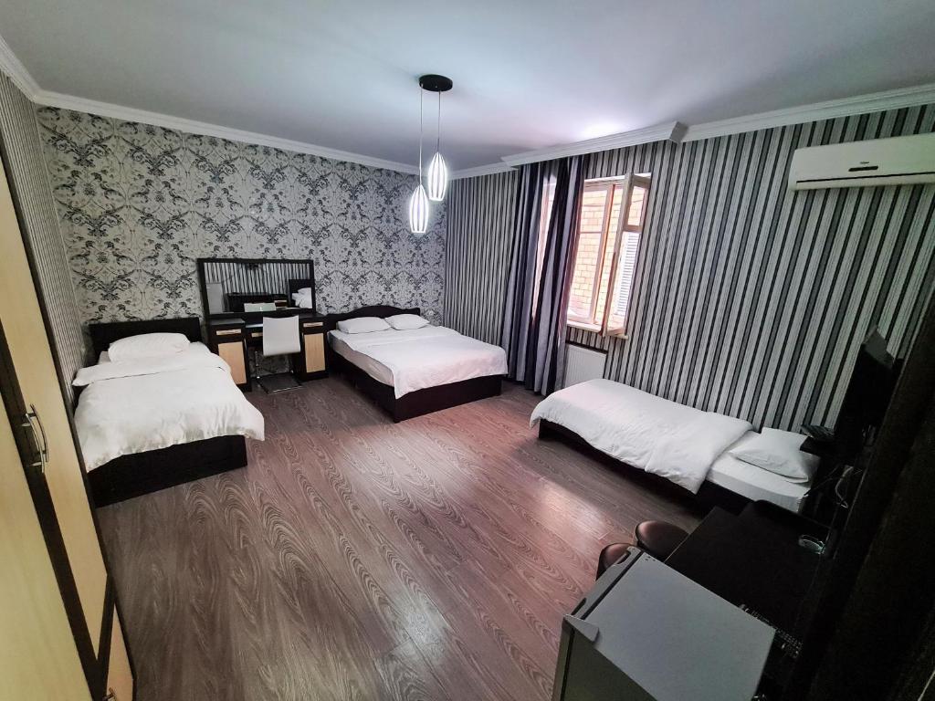 Postel nebo postele na pokoji v ubytování Chveni sakhli