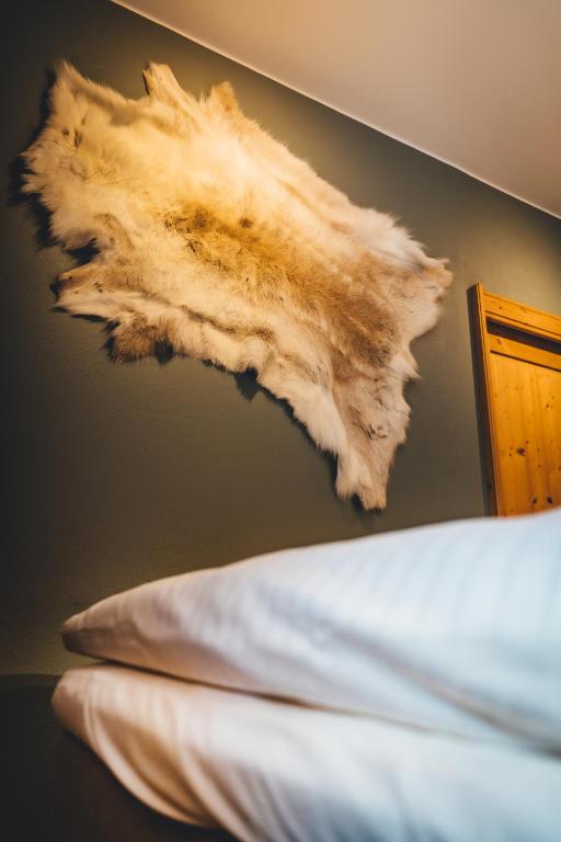 Postel nebo postele na pokoji v ubytování Nordic Lodge