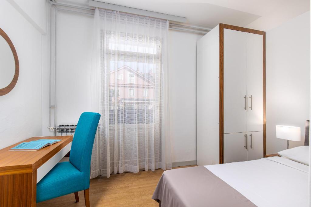 Postel nebo postele na pokoji v ubytování Hotel Zagreb