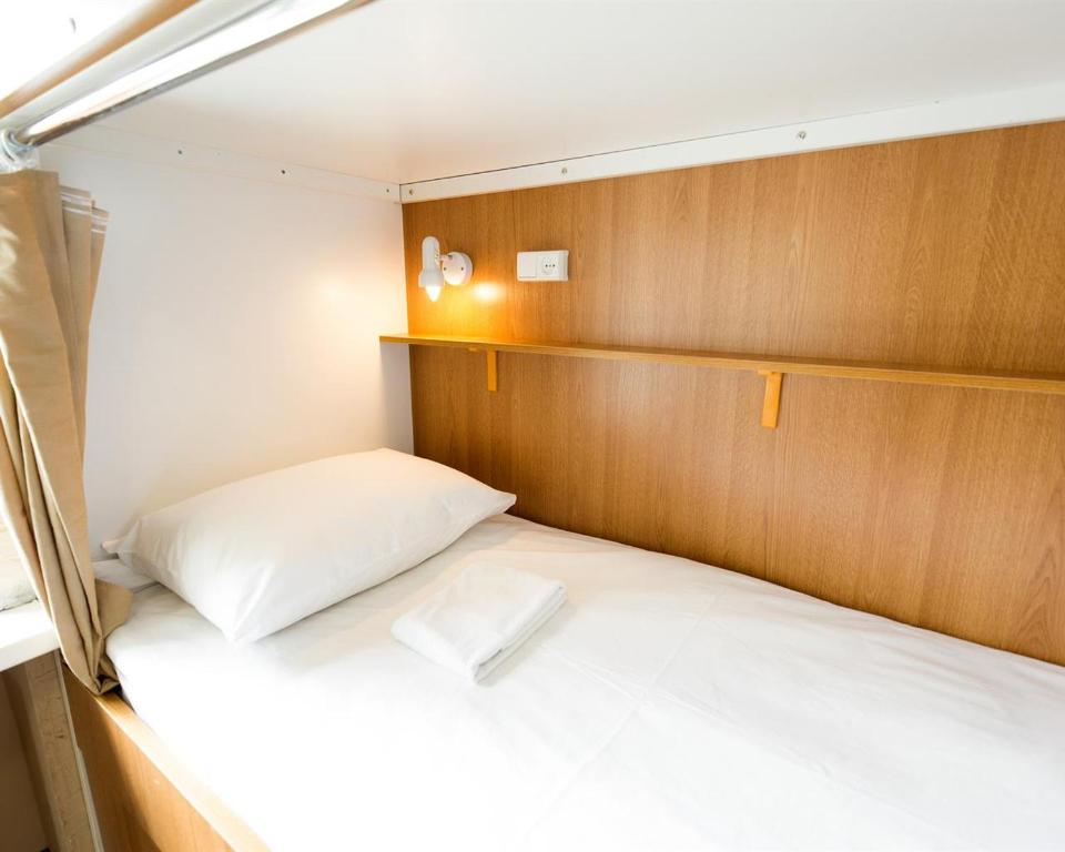 Кровать или кровати в номере Макаров Хостел 