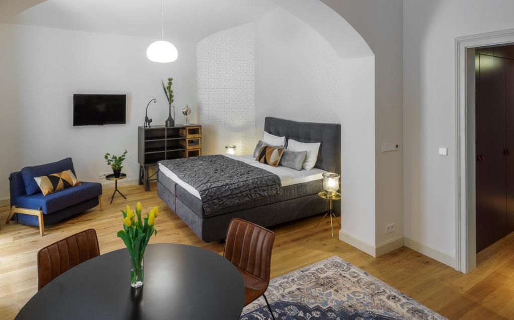 Łóżko lub łóżka w pokoju w obiekcie MN6 Luxury Suites by Adrez