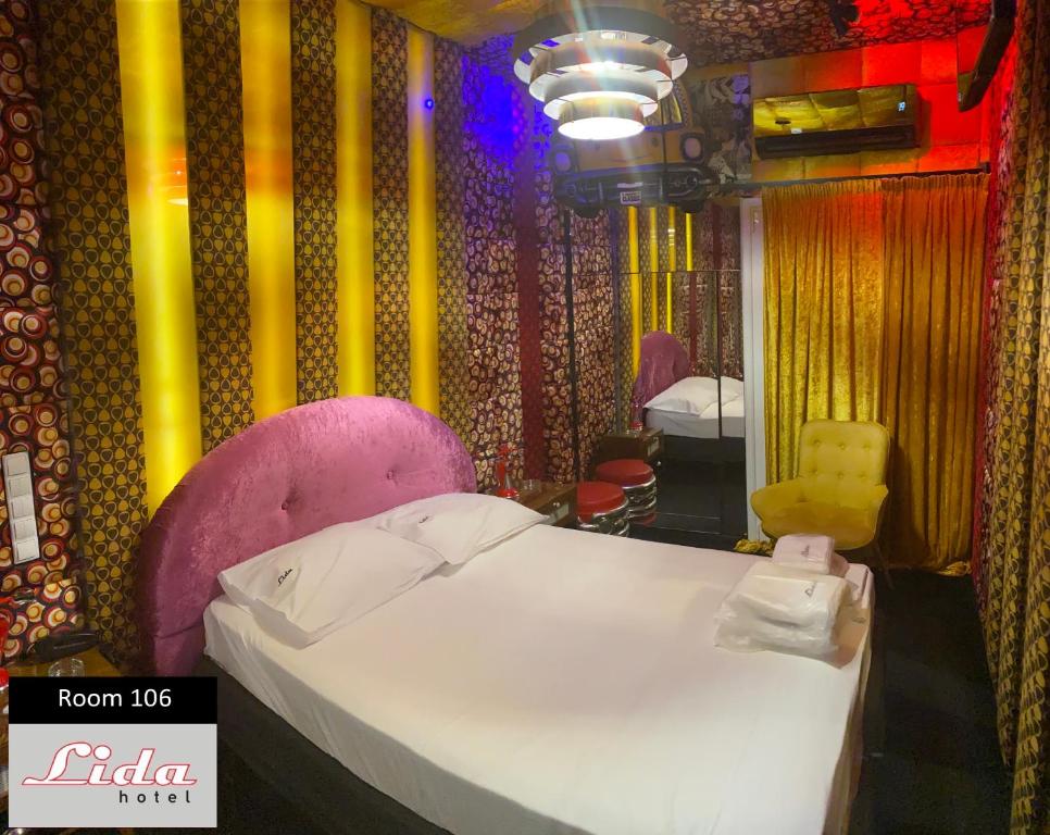 Postel nebo postele na pokoji v ubytování Lida Hotel