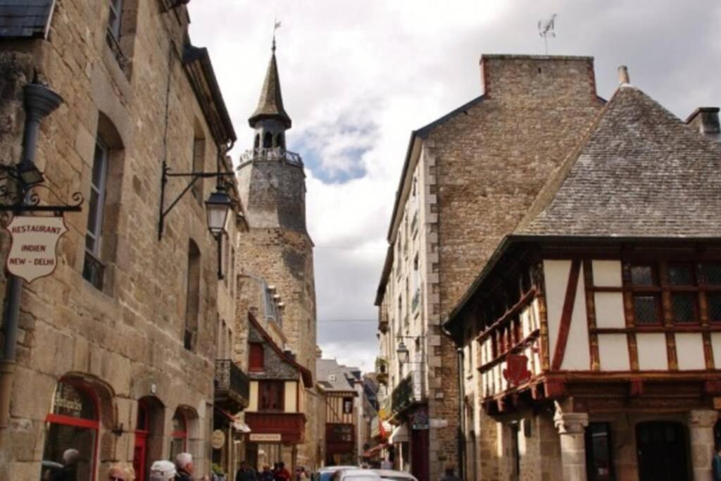 a group of buildings on a street with a tower at T2 situé au cœur du centre historique de Dinan in Dinan