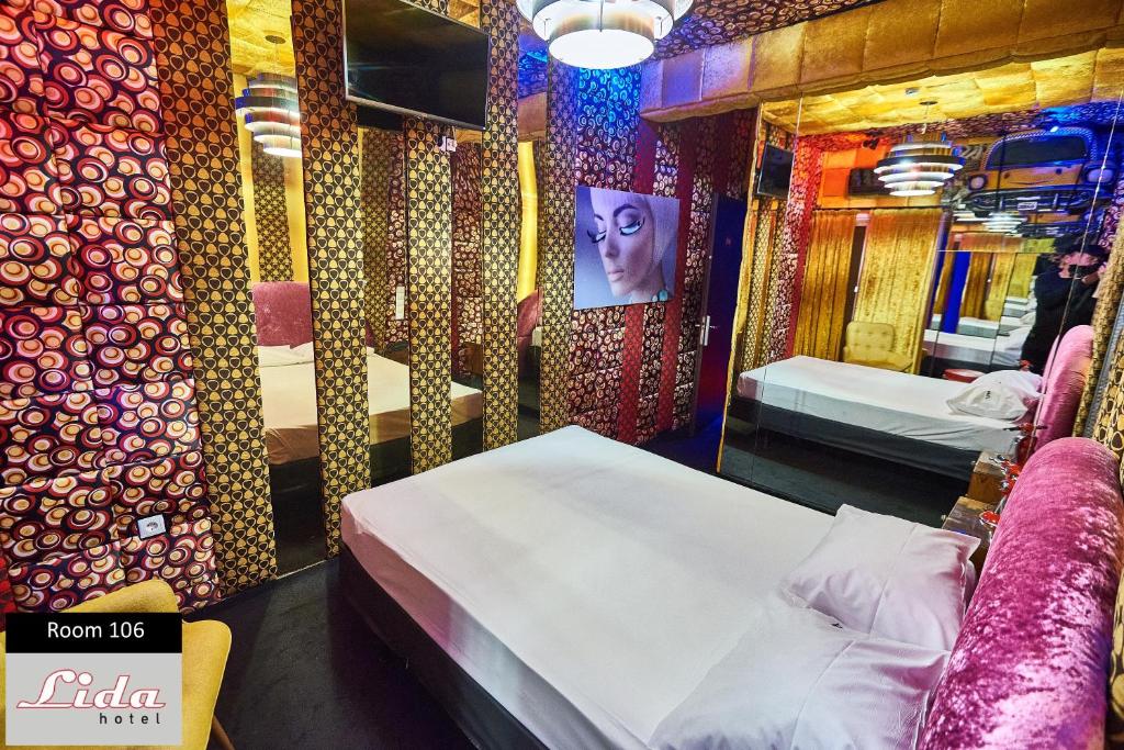 Postel nebo postele na pokoji v ubytování Lida Hotel