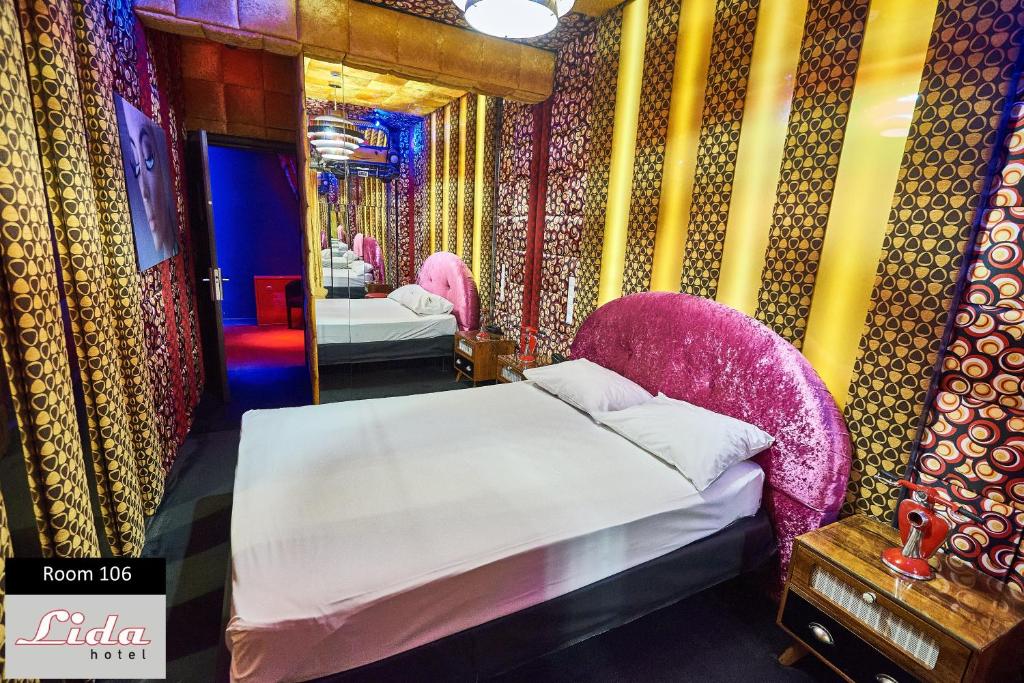Postel nebo postele na pokoji v ubytování Lida Hotel