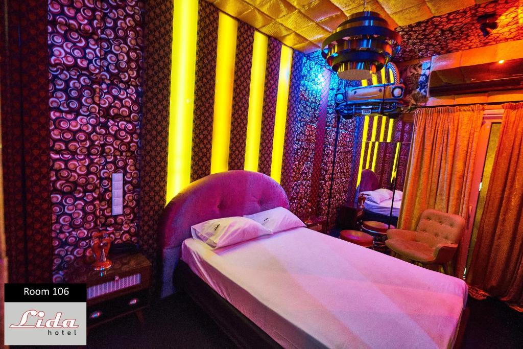Postel nebo postele na pokoji v ubytování Lida Hotel