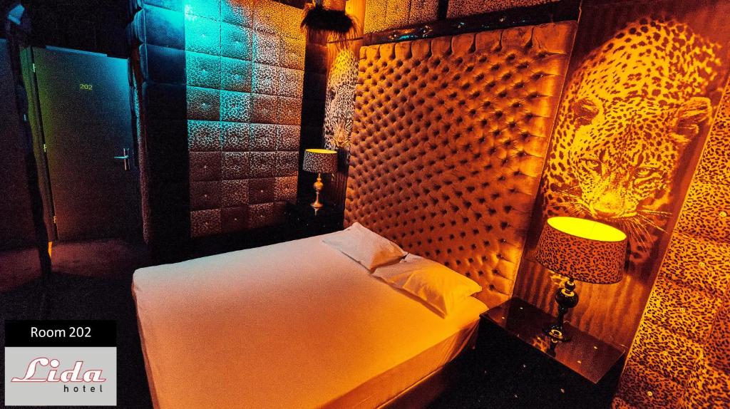 Postel nebo postele na pokoji v ubytování Lida Hotel