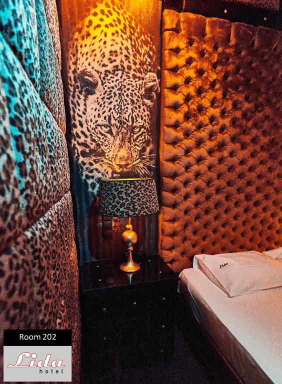 Postel nebo postele na pokoji v ubytování Lida Hotel