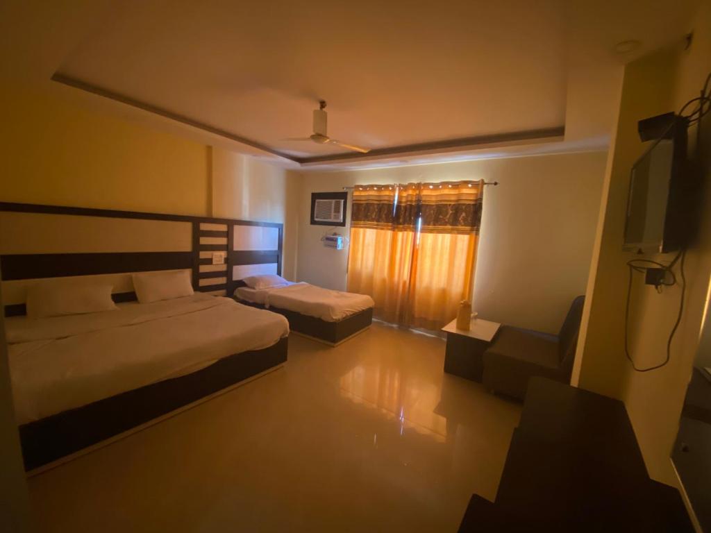 Ένα ή περισσότερα κρεβάτια σε δωμάτιο στο HOTEL THE TARANANT