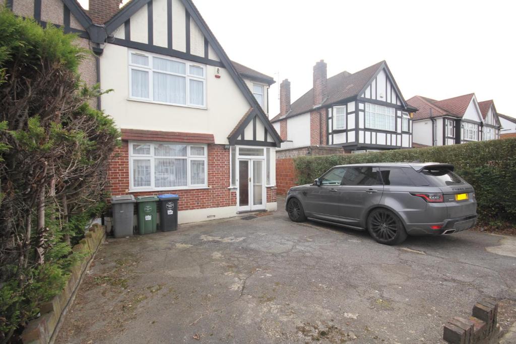 a car parked in front of a house at Kenton House in Wealdstone